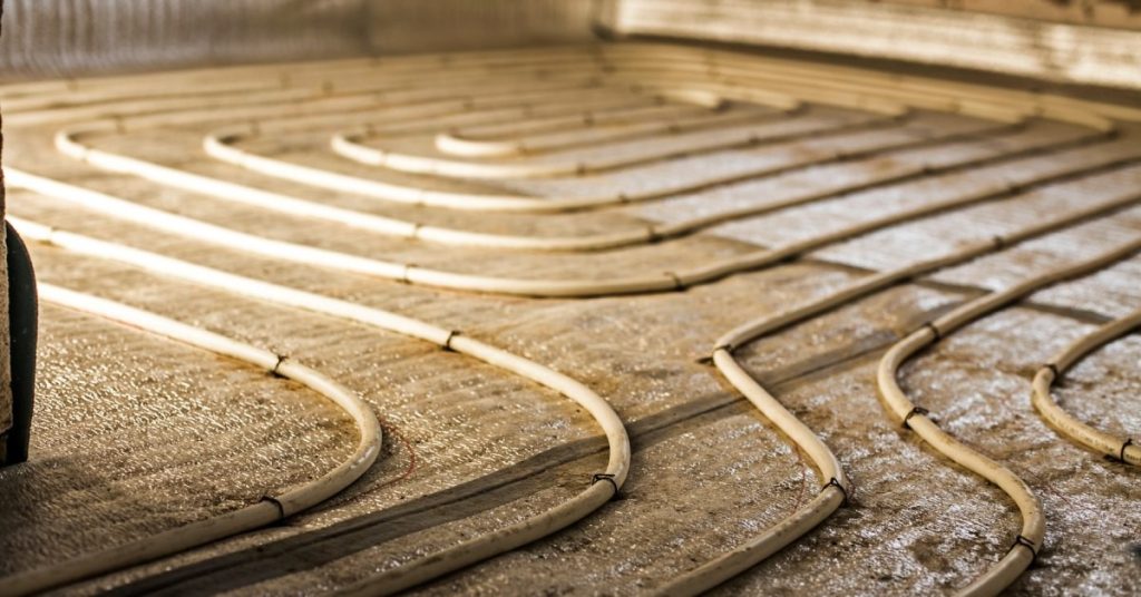 The wires or tubes used to generate heat and comprise a radiant heating system for a bathroom floor.